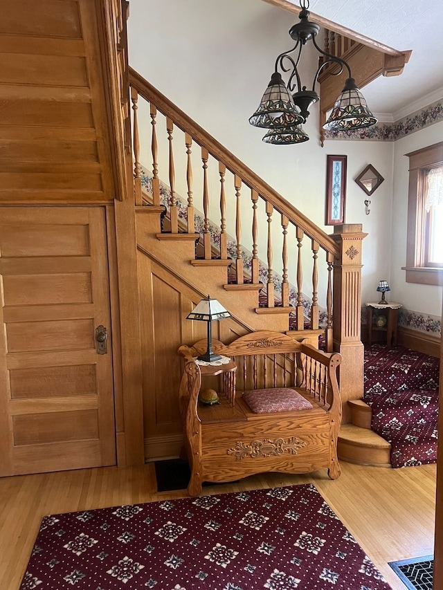 stairway featuring crown molding