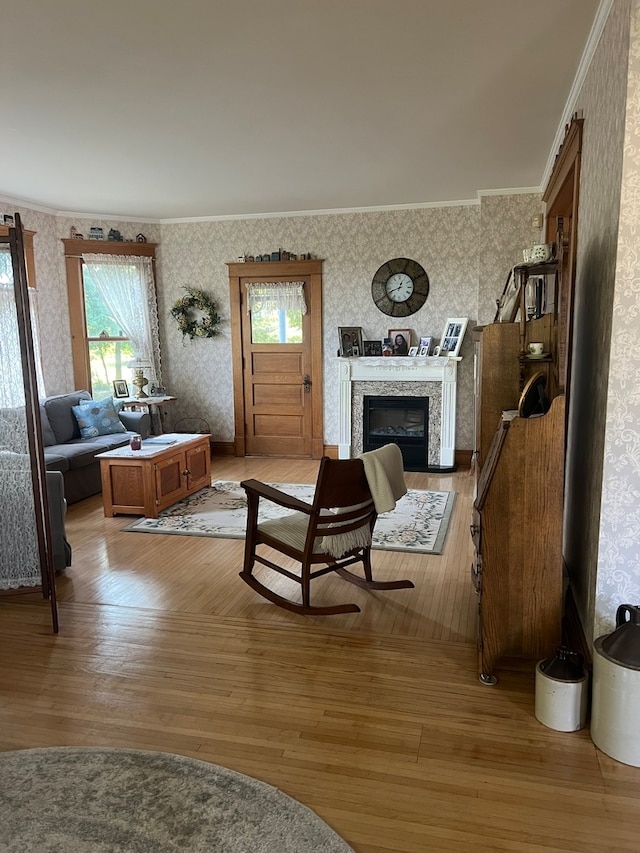 dining space featuring hardwood / wood-style flooring and crown molding