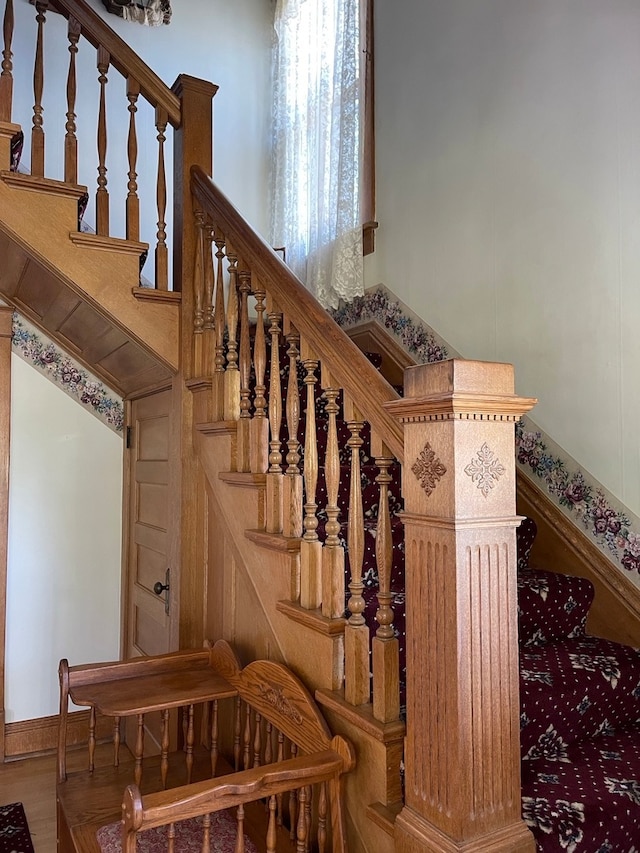 stairway featuring hardwood / wood-style floors