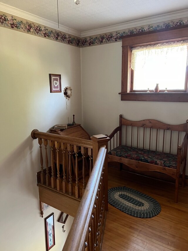 bedroom featuring ceiling fan, ornamental molding, and dark colored carpet