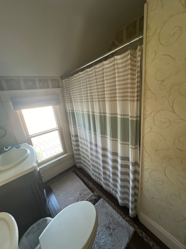 hallway with hardwood / wood-style floors and crown molding