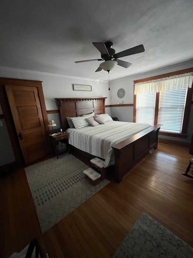 corridor featuring hardwood / wood-style floors and crown molding