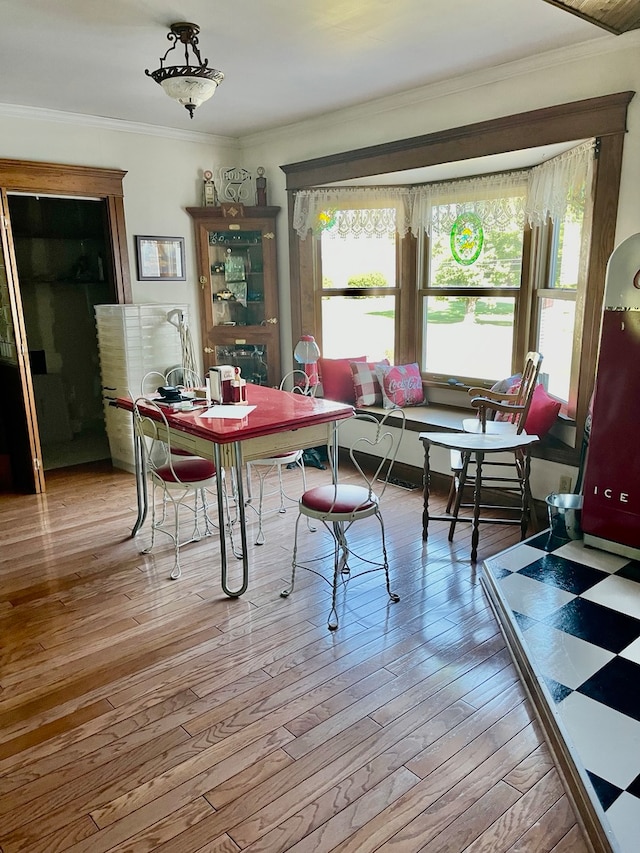 dining area with ceiling fan, wood-type flooring, and french doors