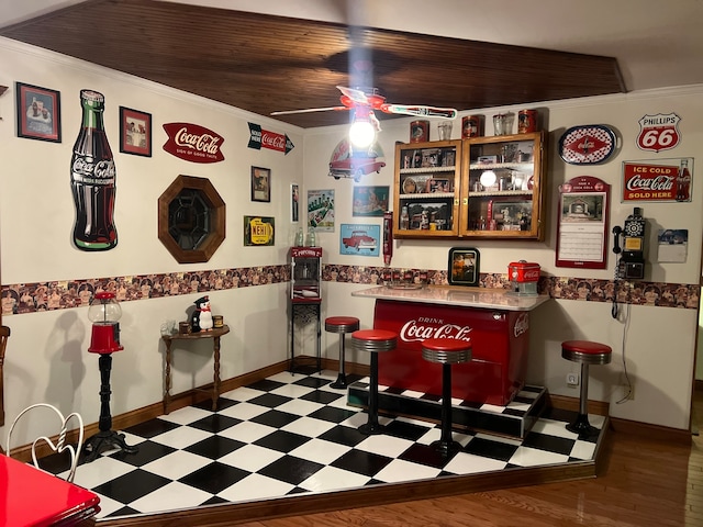 dining area featuring hardwood / wood-style flooring, ceiling fan, and ornamental molding