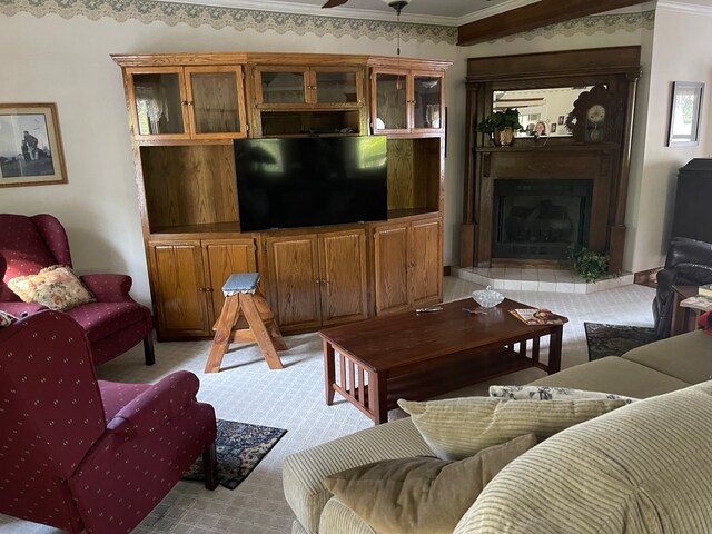 carpeted living room featuring ceiling fan and ornamental molding