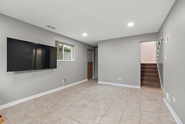 unfurnished living room with light tile patterned floors