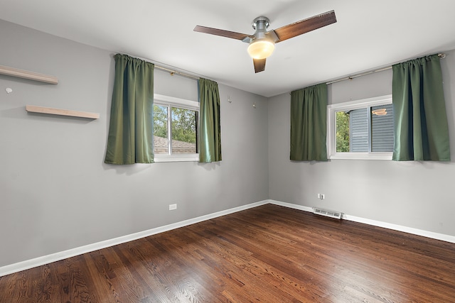 empty room featuring wood-type flooring and ceiling fan