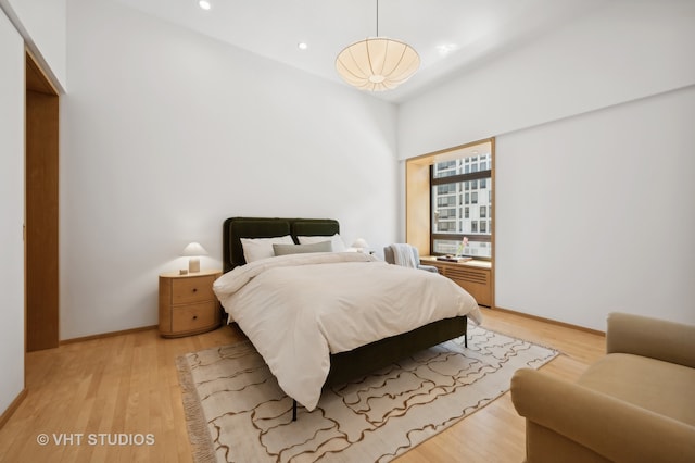 bedroom with light hardwood / wood-style floors