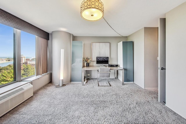 home office featuring a water view, light colored carpet, and a wall mounted AC