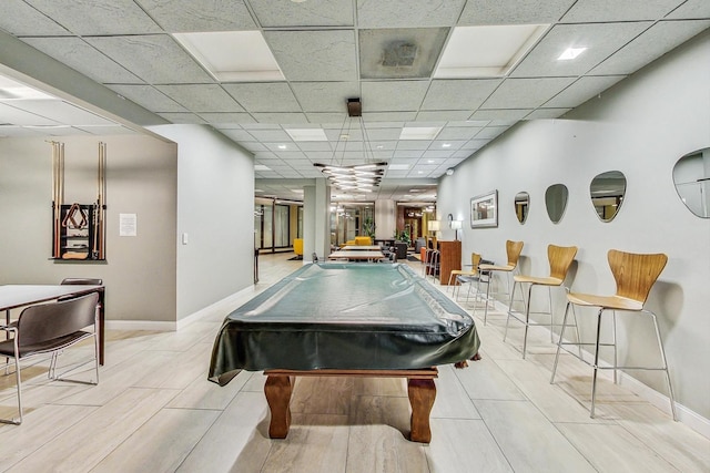 recreation room featuring billiards and a drop ceiling