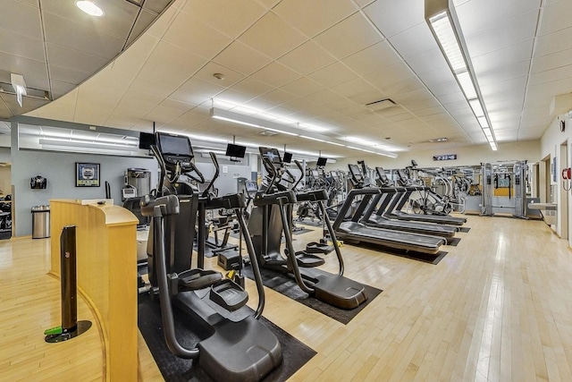 exercise room featuring light hardwood / wood-style floors