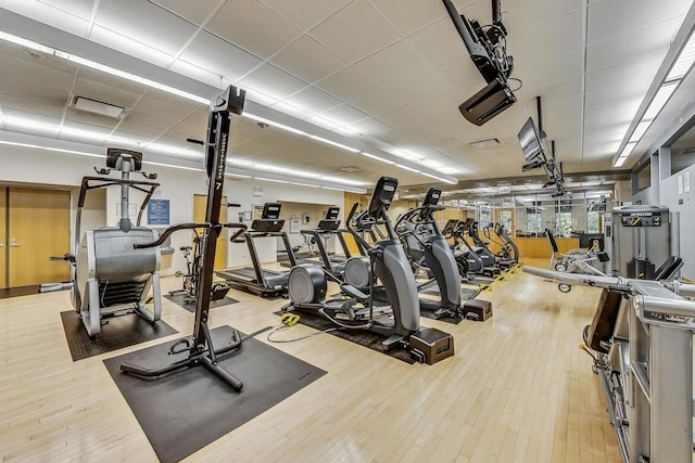 exercise room featuring wood-type flooring