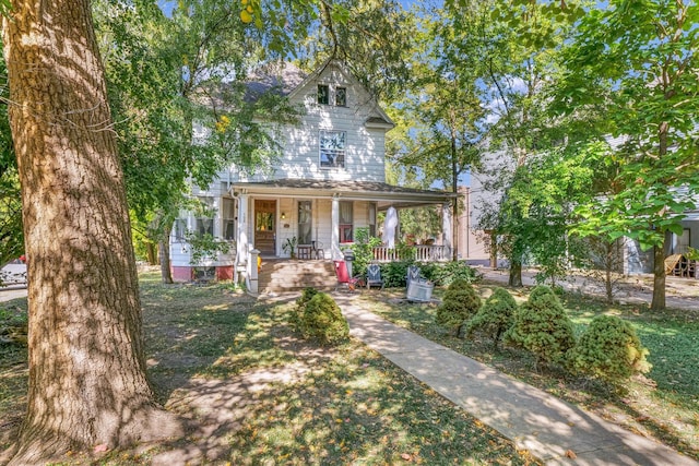 country-style home featuring a porch