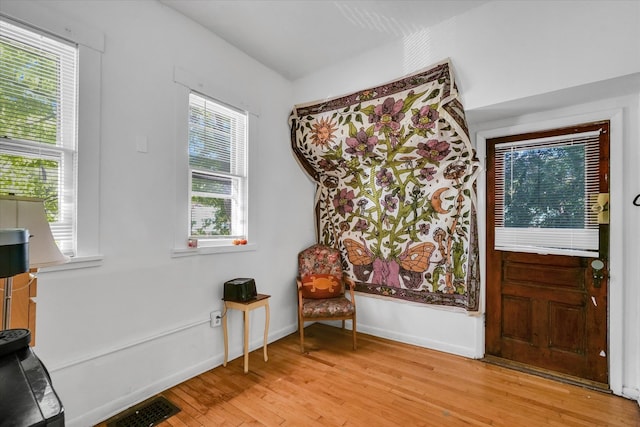 sitting room featuring light wood-type flooring