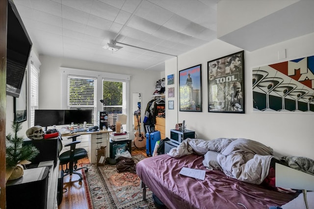 home office with wood-type flooring