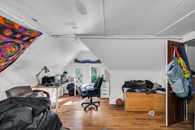 office area featuring lofted ceiling and wood-type flooring