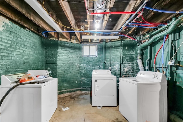 laundry area featuring washing machine and clothes dryer