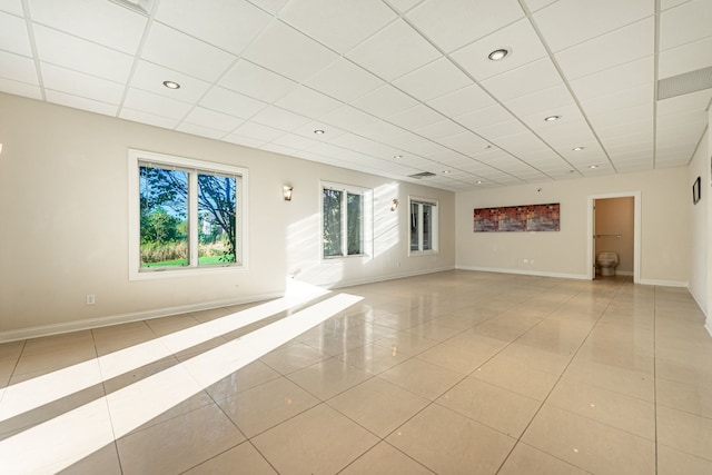 spare room featuring light tile patterned flooring