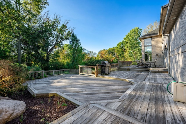 wooden deck with grilling area