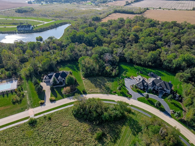 birds eye view of property with a water view and a rural view