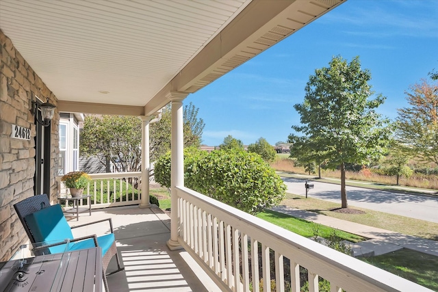 balcony featuring a porch