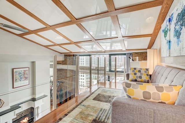 living room with lofted ceiling with beams and wood-type flooring