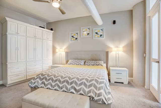 carpeted bedroom featuring ceiling fan and a closet