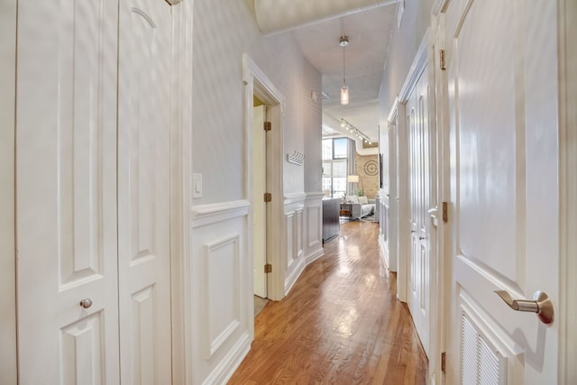 corridor featuring light hardwood / wood-style floors