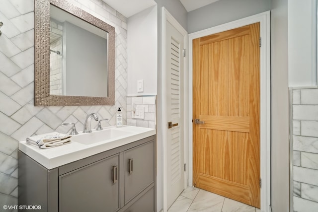 bathroom with backsplash and vanity