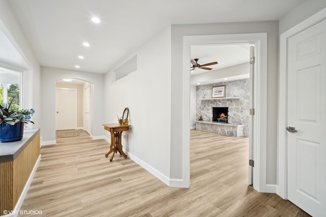 corridor with light hardwood / wood-style flooring