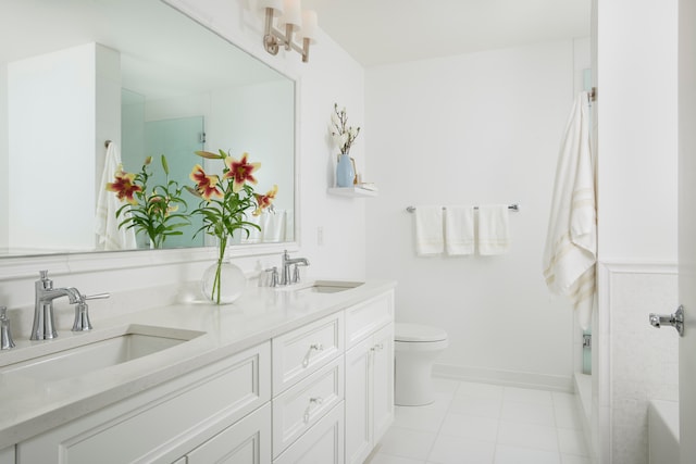 bathroom with walk in shower, vanity, and toilet