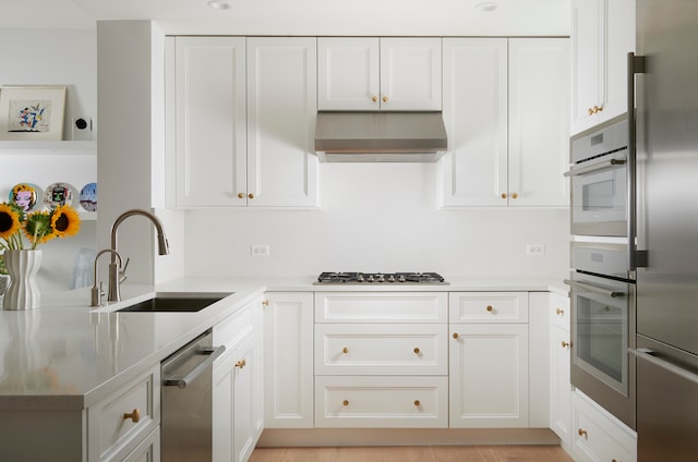 kitchen with white cabinets, sink, and stainless steel appliances