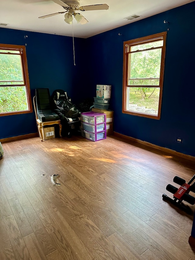 interior space featuring hardwood / wood-style flooring and ceiling fan