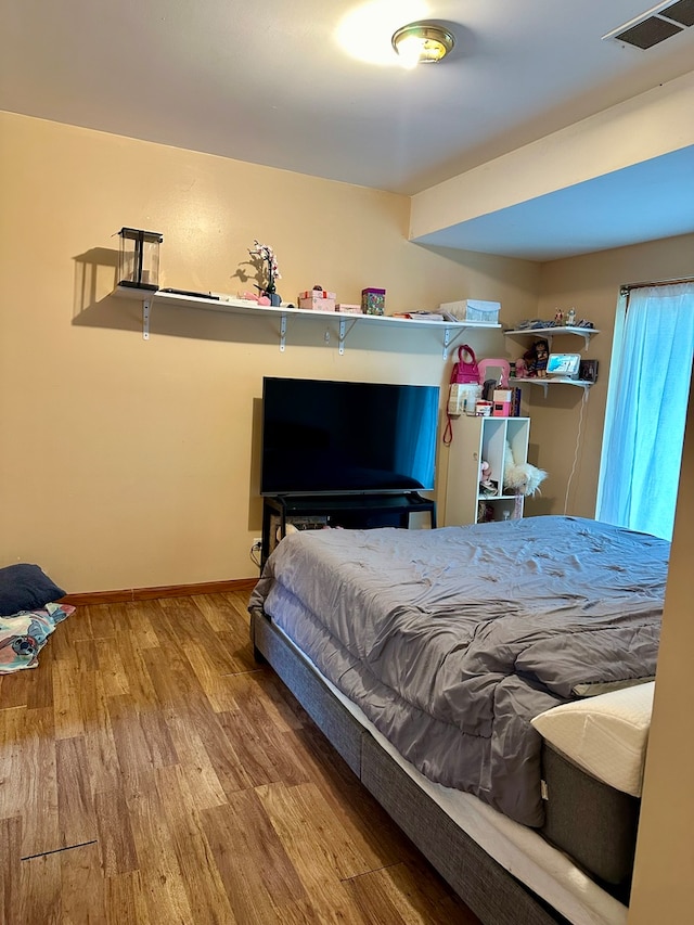 bedroom featuring wood-type flooring