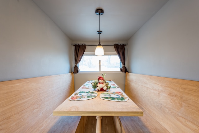 unfurnished dining area featuring wood-type flooring