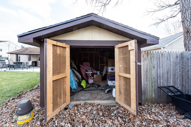 view of outbuilding featuring a lawn