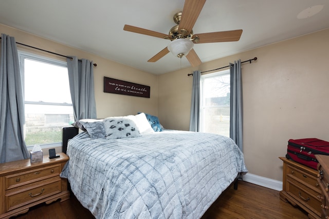 bedroom featuring ceiling fan and dark wood-type flooring