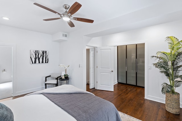 bedroom with ceiling fan and dark hardwood / wood-style flooring