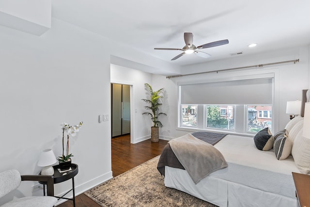 bedroom featuring dark hardwood / wood-style floors and ceiling fan