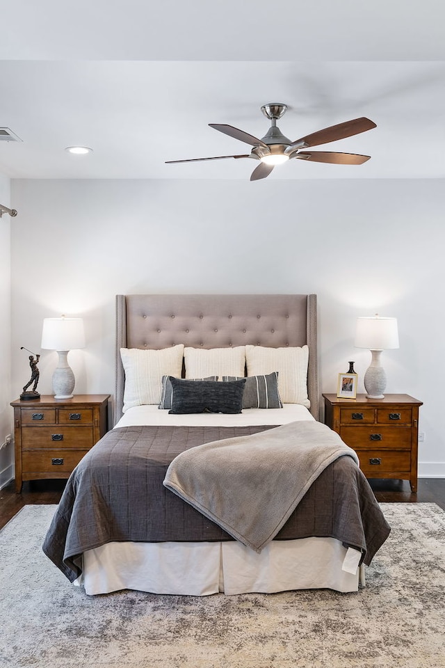 bedroom featuring dark hardwood / wood-style flooring and ceiling fan