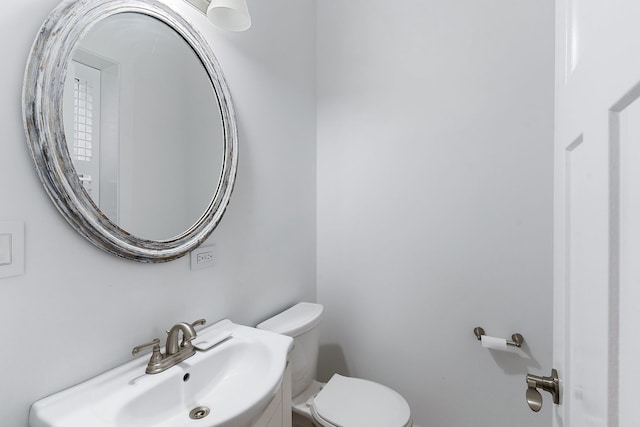 bathroom featuring sink and toilet