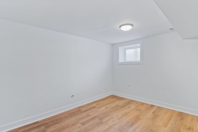 spare room with light wood-type flooring