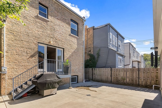 back of house with a patio area