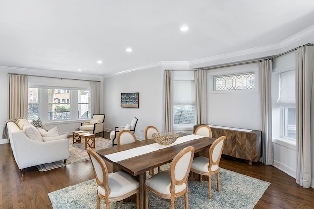 dining space with crown molding and dark wood-type flooring