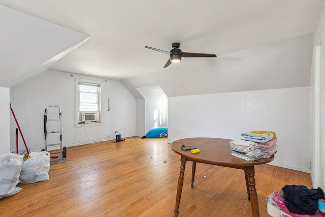 workout room with light hardwood / wood-style floors, lofted ceiling, and ceiling fan