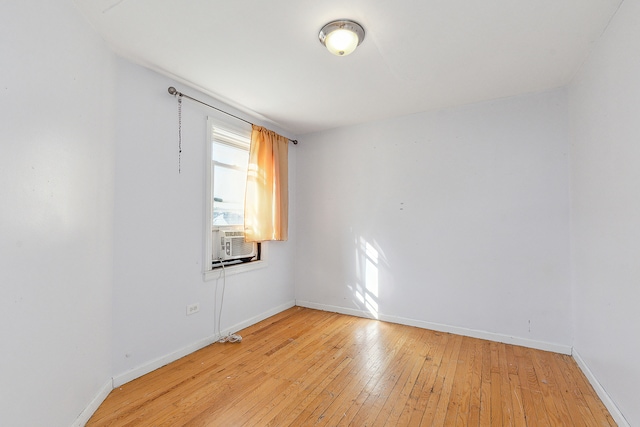 unfurnished room with light hardwood / wood-style floors