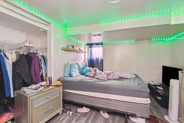 bedroom featuring a closet and hardwood / wood-style floors