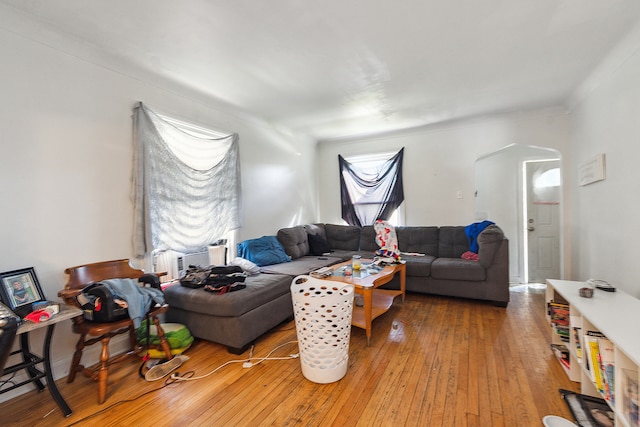 living room with cooling unit and hardwood / wood-style flooring