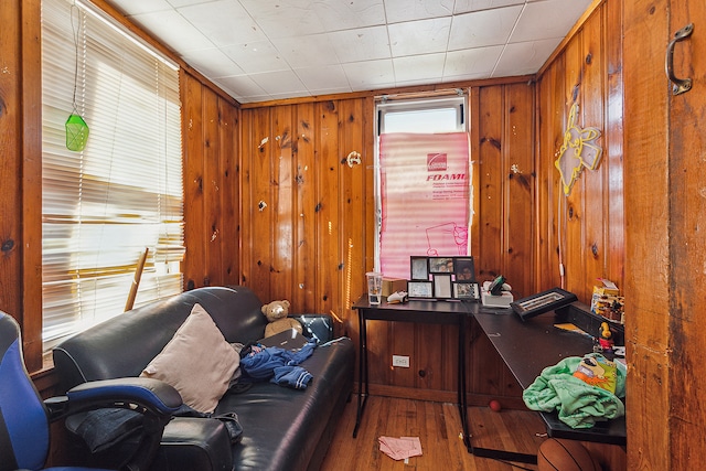 home office featuring wooden walls and hardwood / wood-style floors