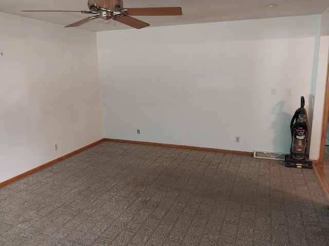 carpeted empty room with ceiling fan